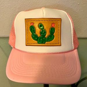 Pink trucker hat with custom leather cactus design